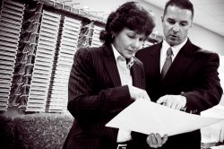 Deborah Karcher checks information on the servers with David Burns, network analyst for M-DCPS.