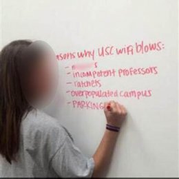 Image: A University of South Carolina student was suspended Friday after a photo of her writing a racial slur on a white board circulated on social media.